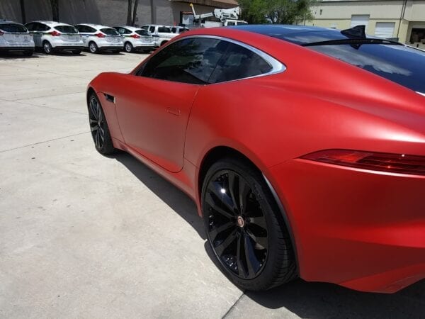 2080-S363 Satin Smoldering Red Wrap Film on a sports car